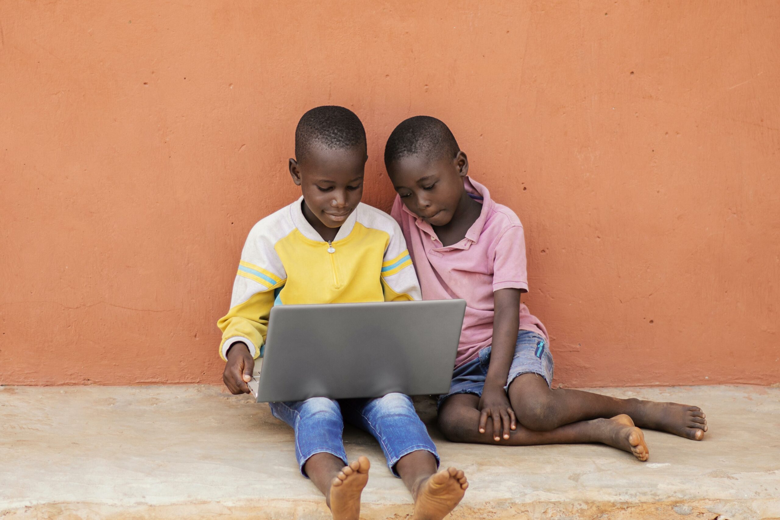 full shot african kids with laptop scaled