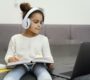 little girl using laptop headphones online school 90x80