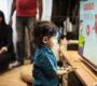 young indian boy watching television 90x80
